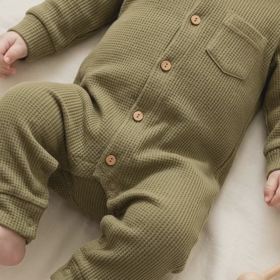 A baby in Sleepsuit