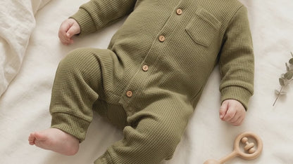 A baby in Sleepsuit